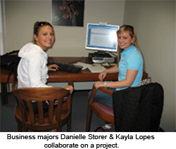 Business majors Danielle Storer & Kayla Lopes collaborate on a project